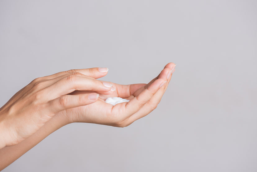Image of woman applying to her hands LEITIN Skincare Hand Lotion