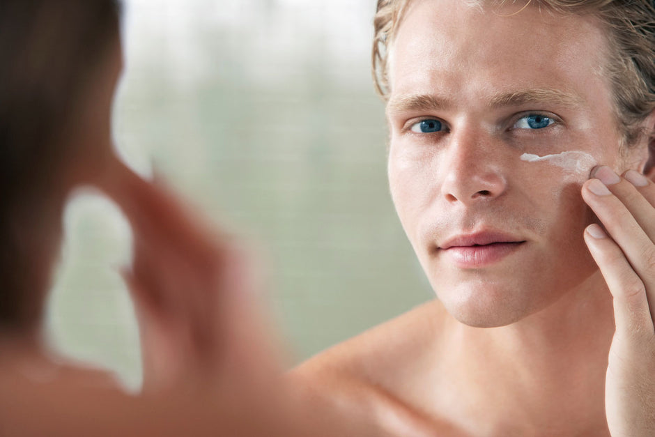 Image of a young man applying water bomb face cream